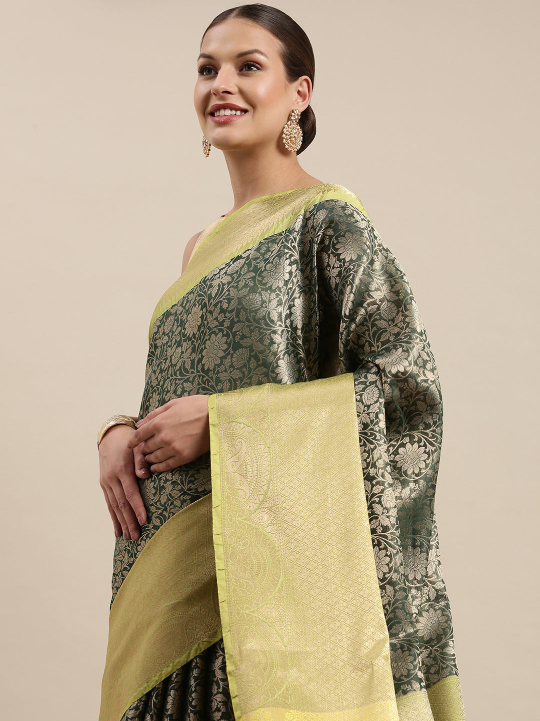 Faishana Presents Presents Bottle Green Zari Patan Patola Contrast Zari Brocade Pistachio Pattu Border Banarasi Saree.