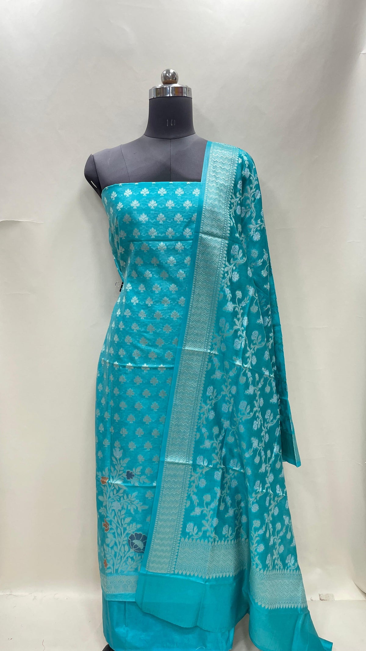 Faishana Turqouise Blue Semi Georgette Suit with Floral Ikkat Mina Border Plain Bottom and Zari Jaal Dupatta SHL_107