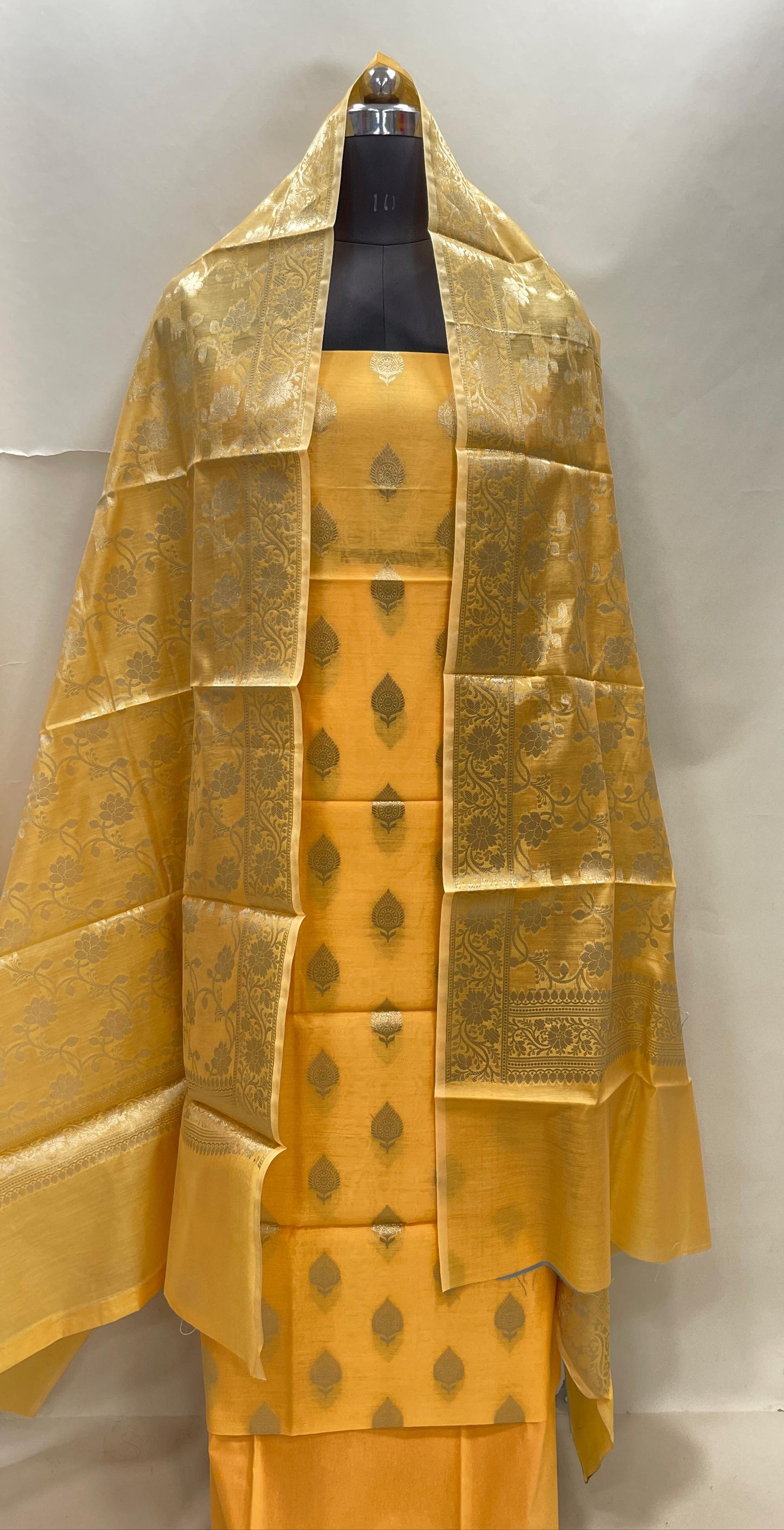 Yellow cotton suit set with floral zari bootis and matching dupatta. SHL_70