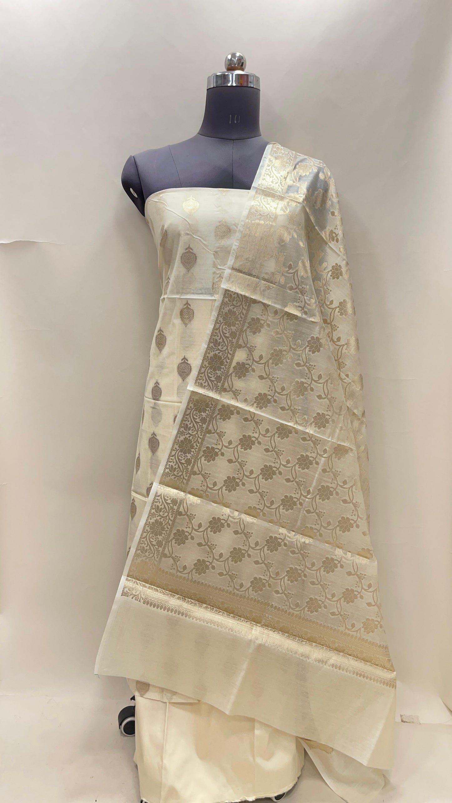 Beige cotton suit set featuring floral zari bootis and yellow dupatta. SHL_73