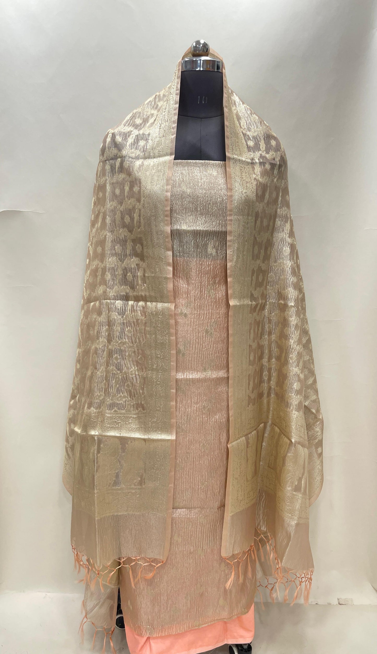 Peach tissue suit with floral zari booti, plain bottom, and checkered dupatta. SHL_82