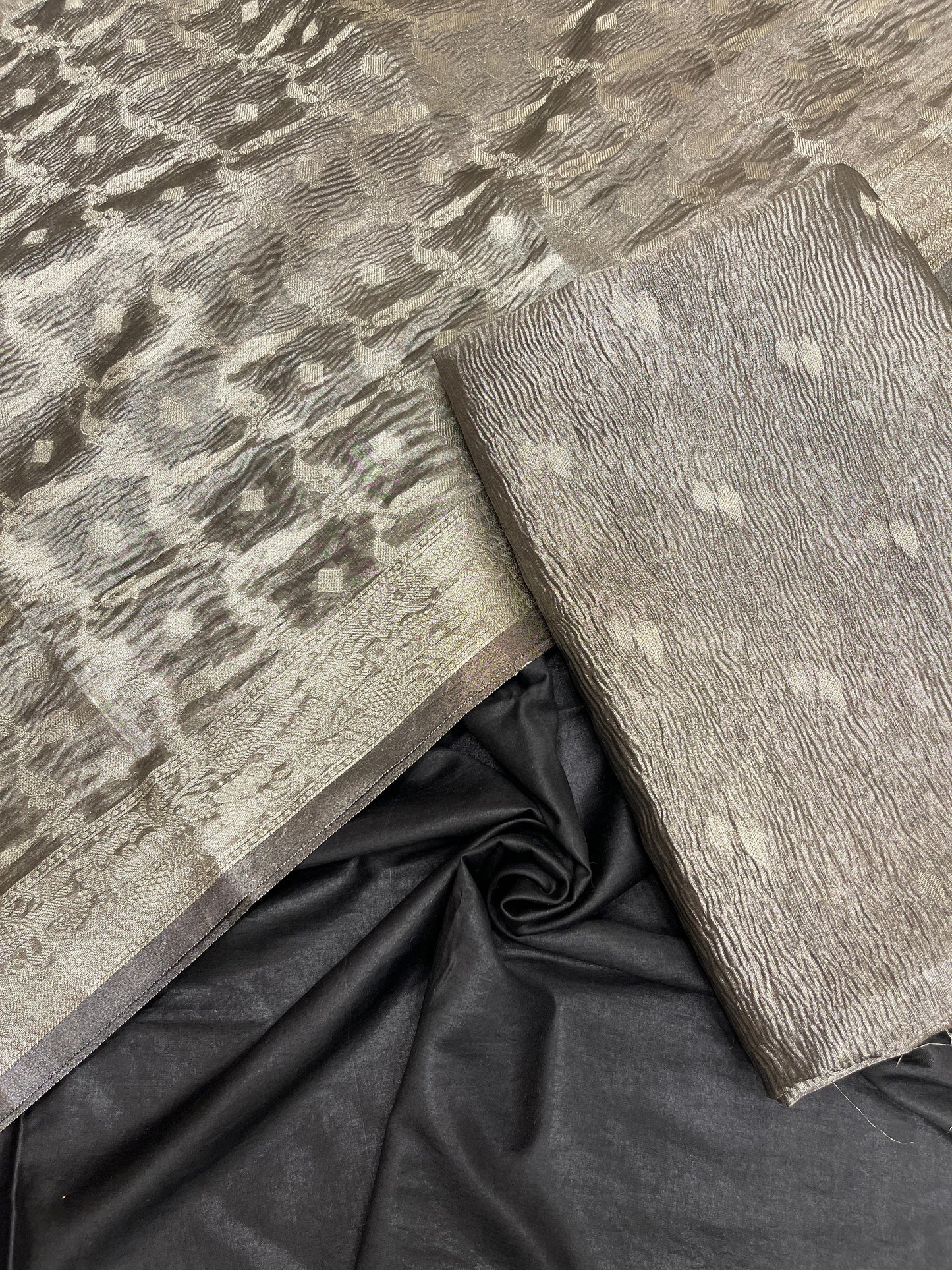 Black tissue suit with floral zari booti, plain bottom, and checkered dupatta. SHL_85
