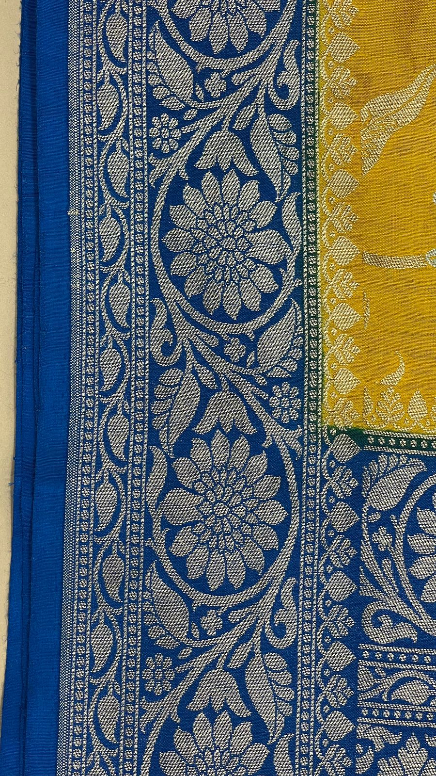 Faishana Presents Yellow Tussar Silk Handpainted Floral Zari Jaal with Contrast Blue Banarasi Floral Jaal Pallu Zari Border and Blue Blouse