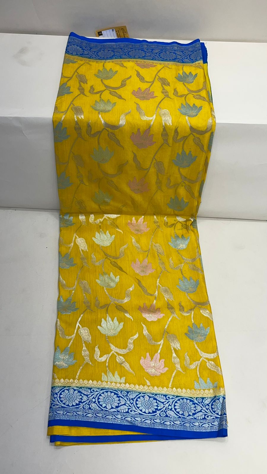 Faishana Presents Yellow Tussar Silk Handpainted Floral Zari Jaal with Contrast Blue Banarasi Floral Jaal Pallu Zari Border and Blue Blouse