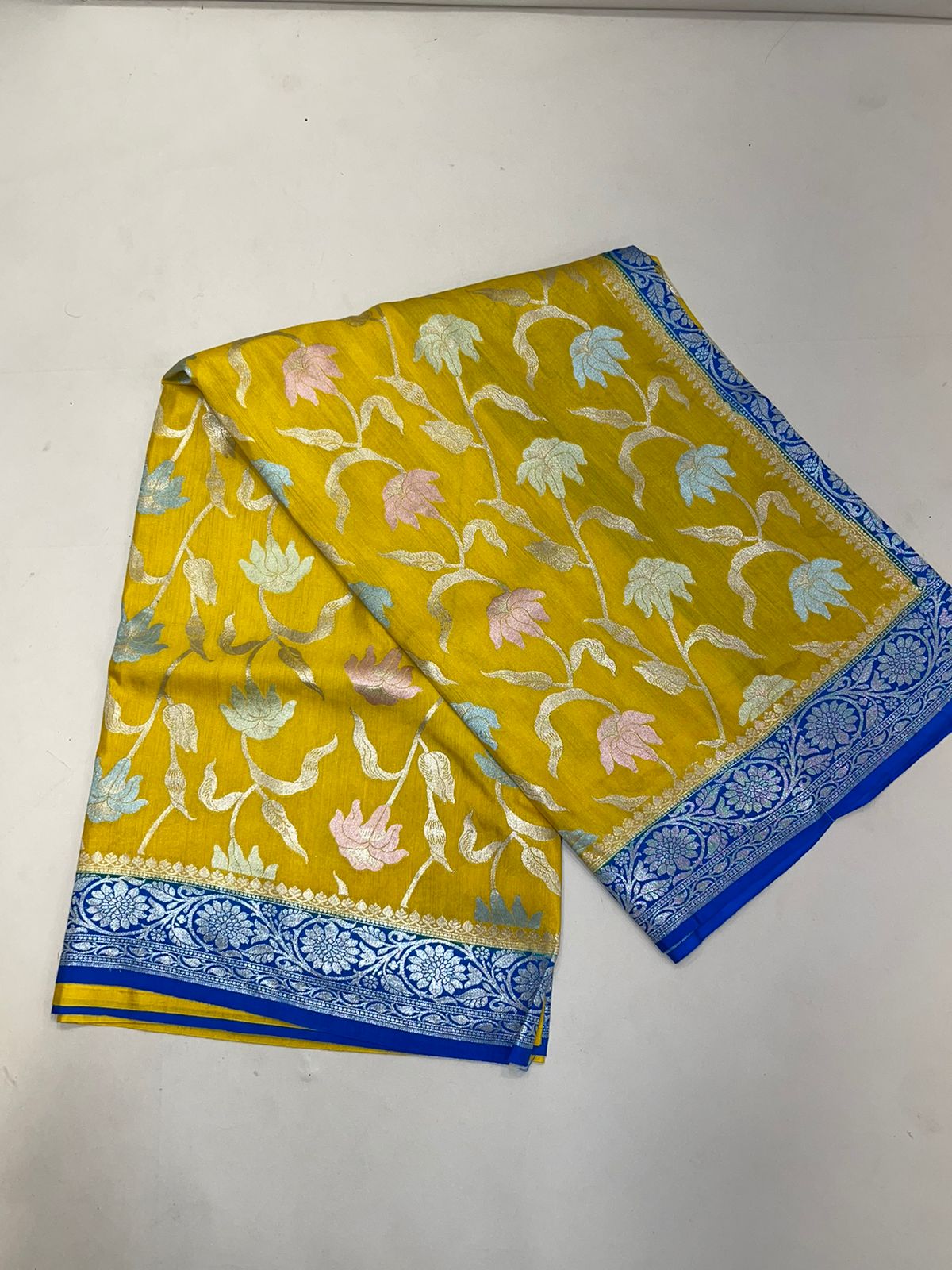 Faishana Presents Yellow Tussar Silk Handpainted Floral Zari Jaal with Contrast Blue Banarasi Floral Jaal Pallu Zari Border and Blue Blouse