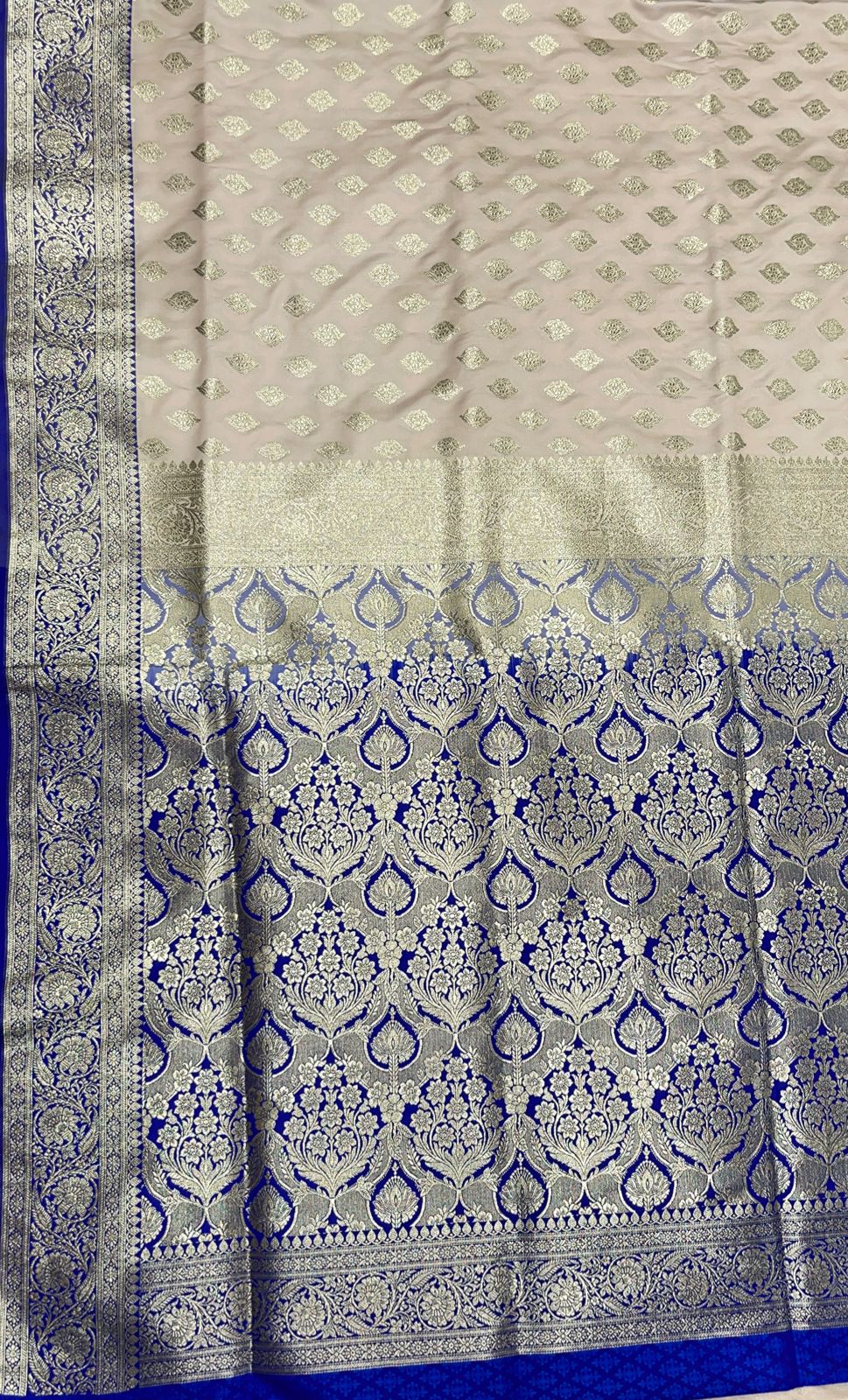 Faishana Presents Off-White Katan Silk Floral Light Gold Zari Booti with Contrast Blue Floral Pallu Banarasi saree and Blue Blouse