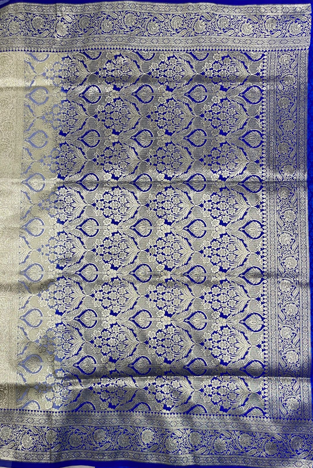 Faishana Presents Off-White Katan Silk Floral Light Gold Zari Booti with Contrast Blue Floral Pallu Banarasi saree and Blue Blouse