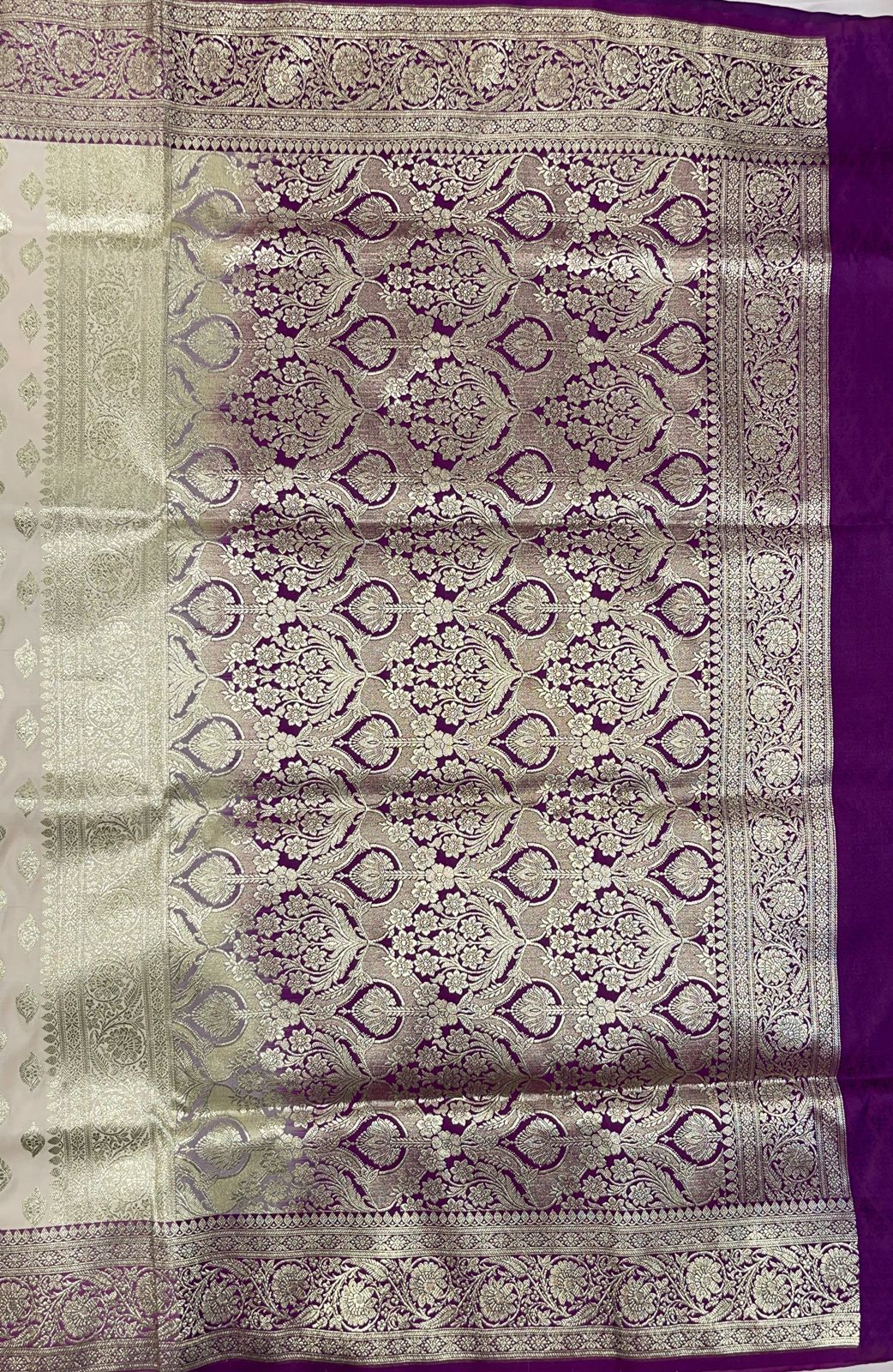 Faishana Presents Off-White Katan Silk Floral Light Gold Zari Booti with Contrast Purple Floral Pallu Banarasi saree and Purple Blouse