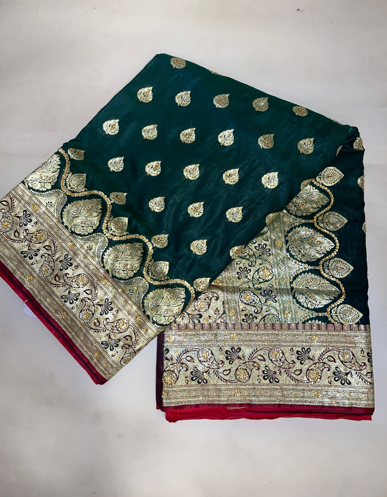 Faishana Presents Dark Green Stone Work Golden Zari Booti with Contrast Red Paisley Lehariya Pallu Zari Border with Red Blouse Banarasi Saree