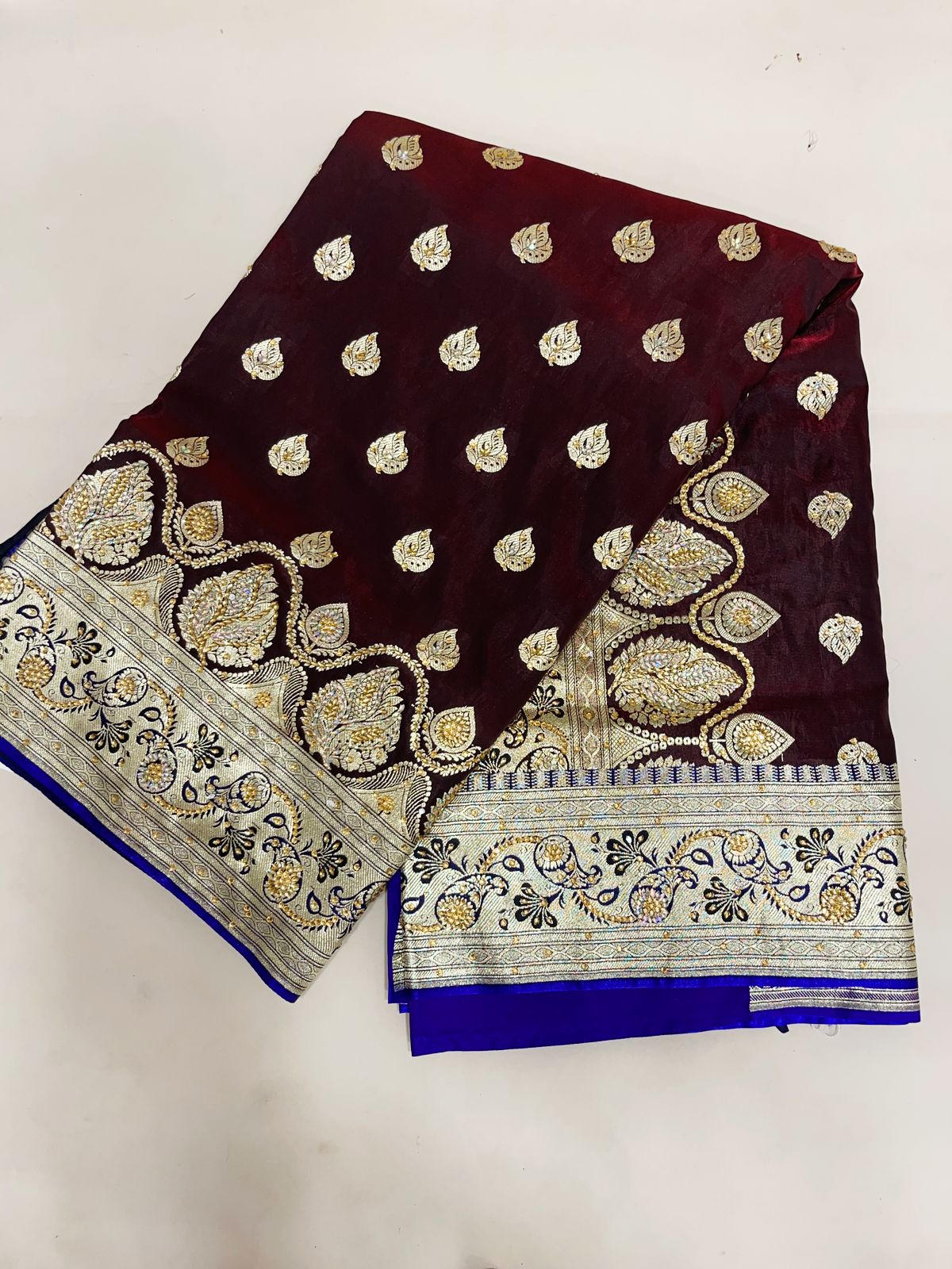 Faishana Presents Brown Stone Work Golden Zari Booti with Contrast Blue Paisley Lehariya Pallu Zari Border with Blue Blouse Banarasi Saree