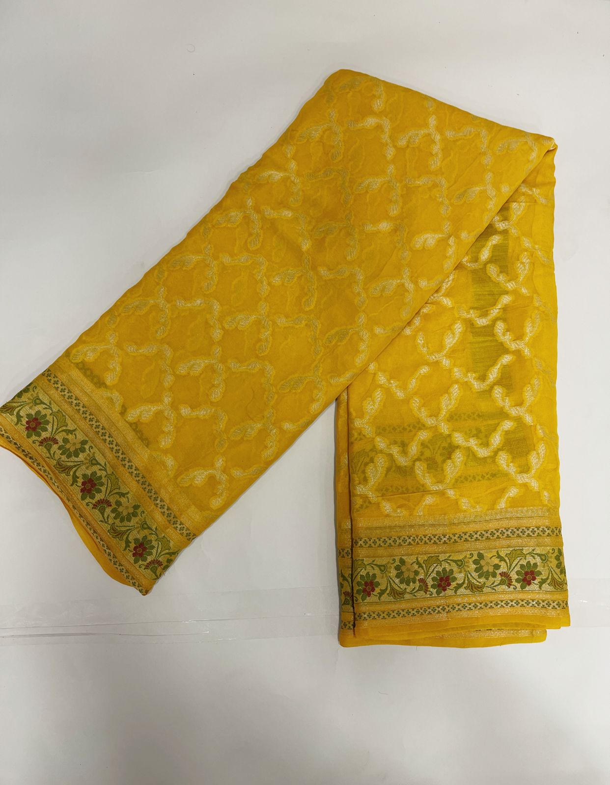 Faishana Pure Handloom Yellow Chiffon Gold Zari Jaal with Floral Mina Jaal Anchal and Tilfi Zari Border with Yellow Blouse
