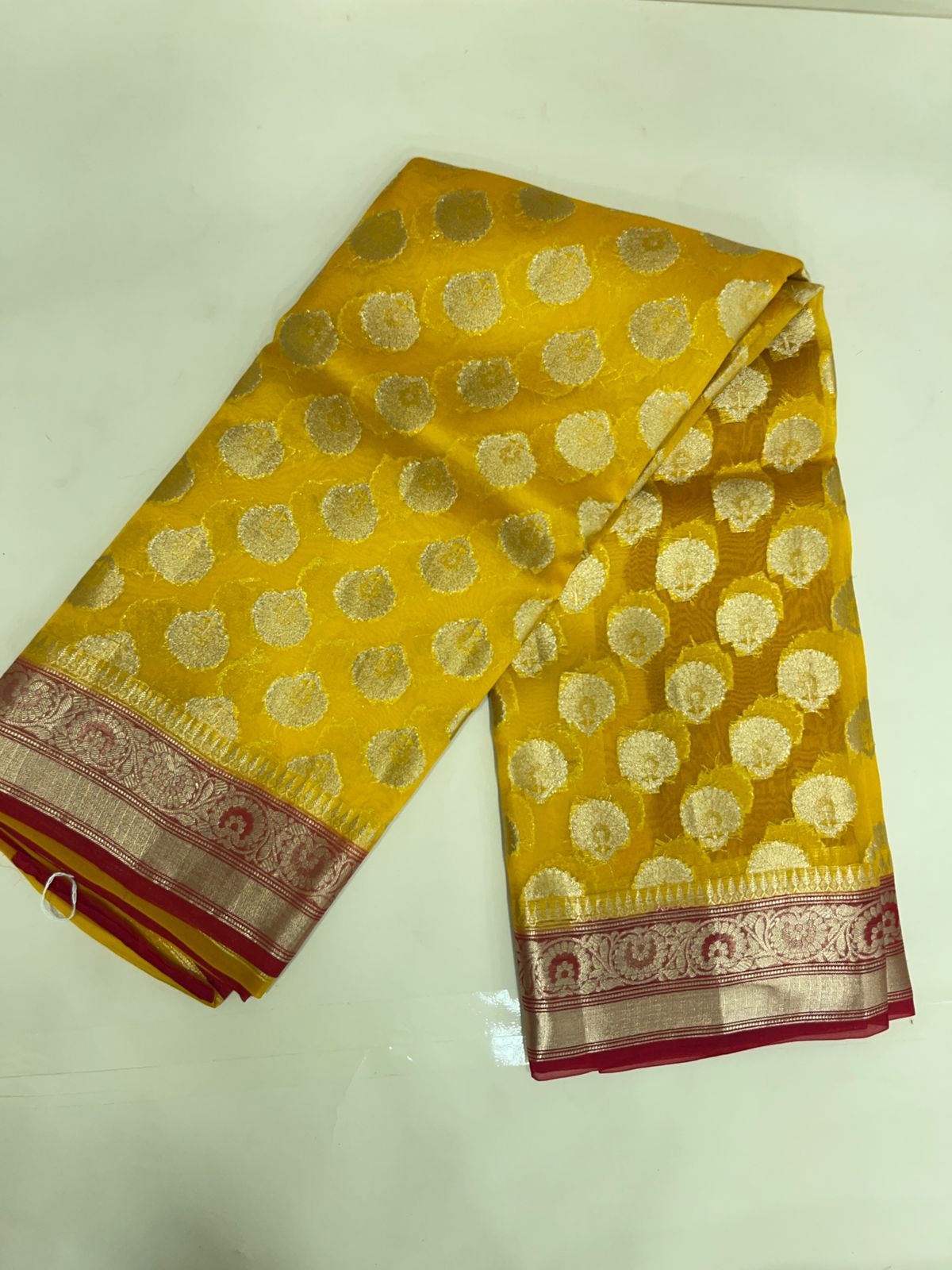 Faishana Pure Handloom Yellow Organza Floral Zari Booti with Contrast Red Big Floral Boota Pallu Zari Border and Red Blouse