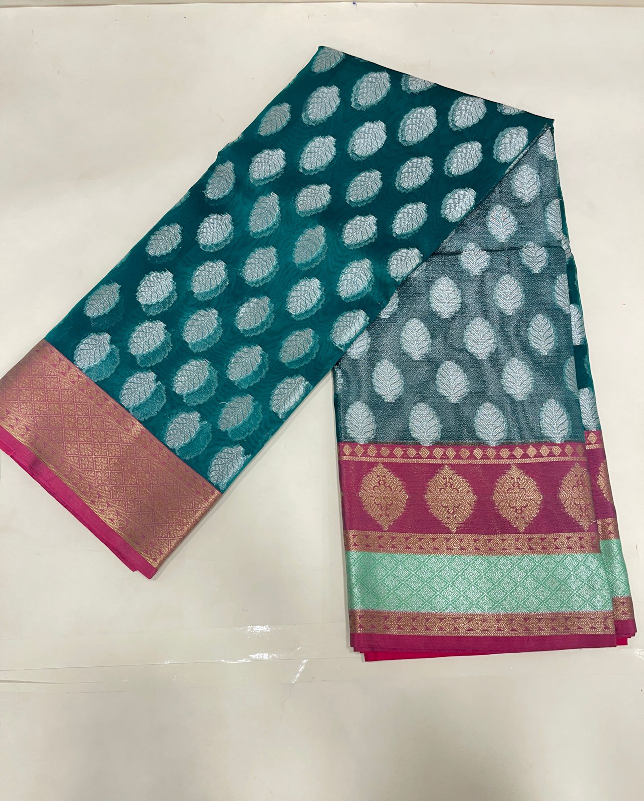 Faishana Presents Green Organza Silver Zari Floral Booti with Contrast Light Purple Floral Booti Pallu and Skirt Zari 2D Border with Light Purple Blouse
