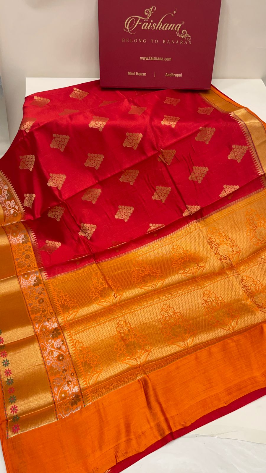 Faishana Pure Handloom Red Chiniya Silk Golden Floral Zari Booti Contrast Orange Skirt Silver Mina Zari Dual Border and Orange Floral Boota Pallu with Orange Blouse