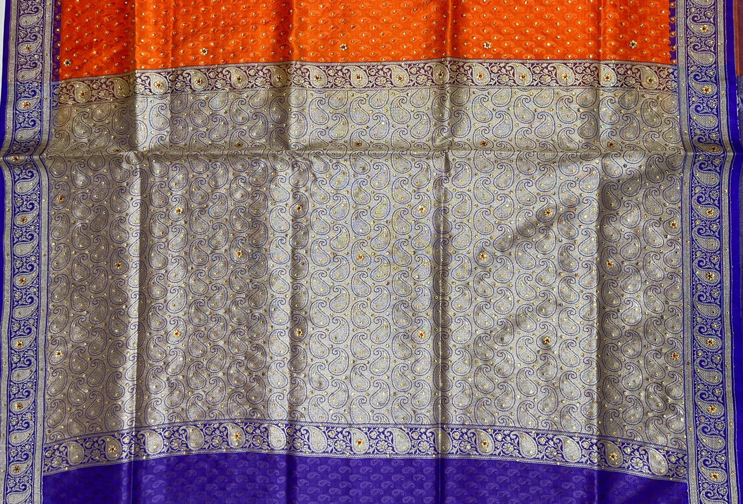 Faishana Presents Orange Tanchoi Silk Low Stone Work with Contrast Blue Pallu Zari Border and Purple Blouse