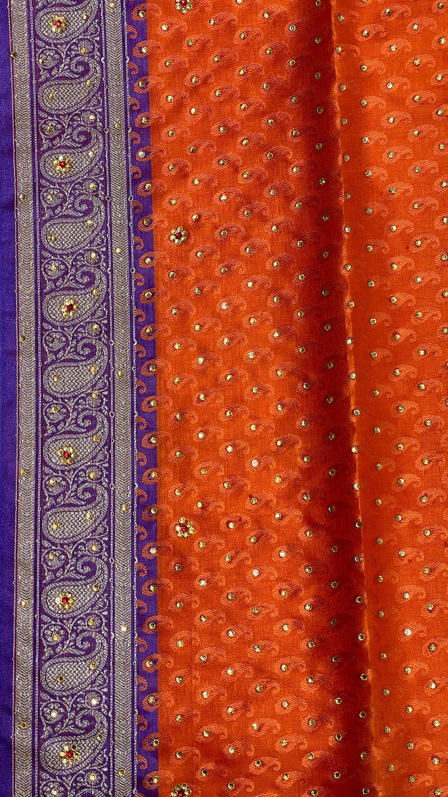 Faishana Presents Orange Tanchoi Silk Low Stone Work with Contrast Blue Pallu Zari Border and Purple Blouse