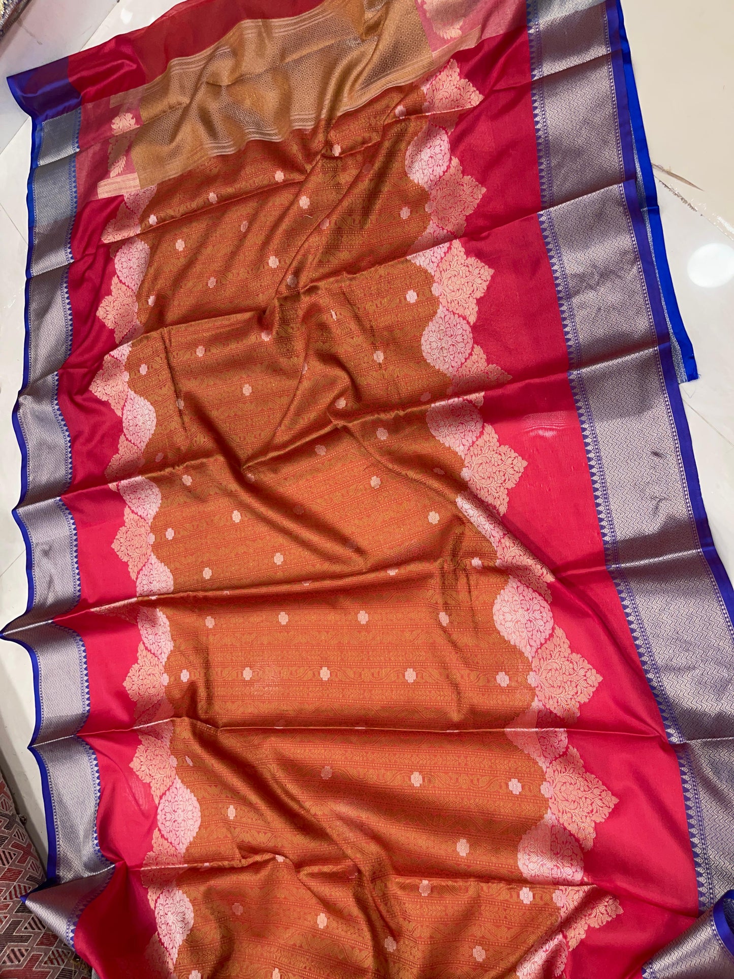 Faishana Presents Orange Floral Mina Zari Stripe and Dual Skirt Copper and Silver Boota with Contrast Beige Pallu Blue Zari Border and Blue Blouse