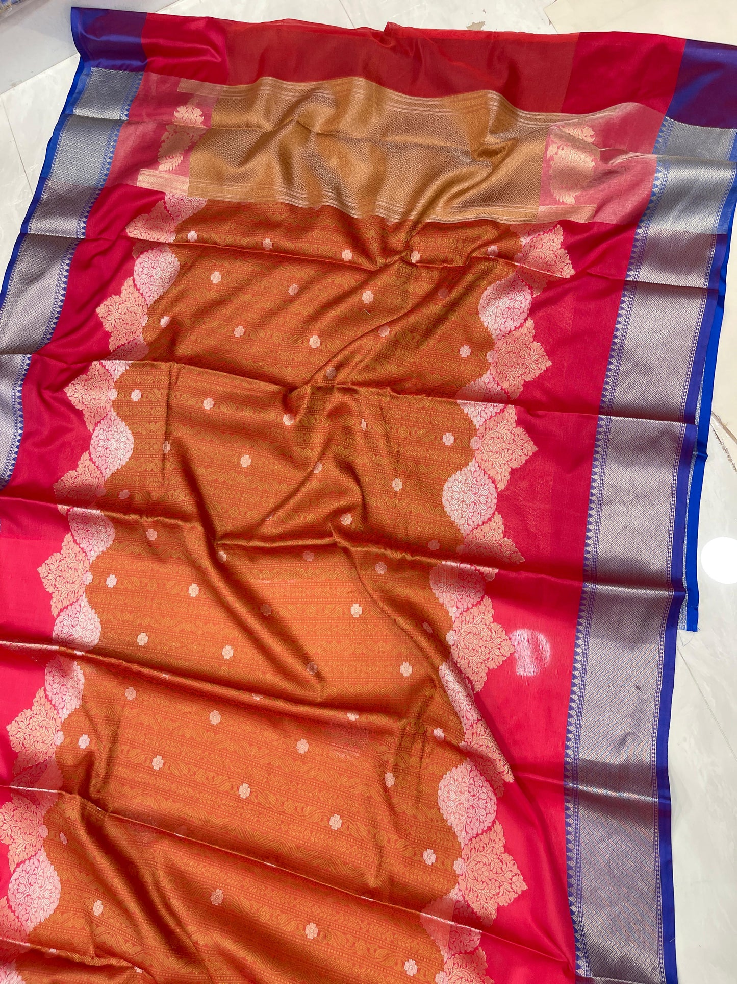 Faishana Presents Orange Floral Mina Zari Stripe and Dual Skirt Copper and Silver Boota with Contrast Beige Pallu Blue Zari Border and Blue Blouse