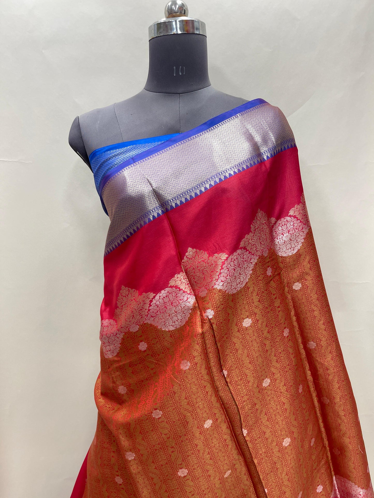 Faishana Presents Orange Floral Mina Zari Stripe and Dual Skirt Copper and Silver Boota with Contrast Beige Pallu Blue Zari Border and Blue Blouse