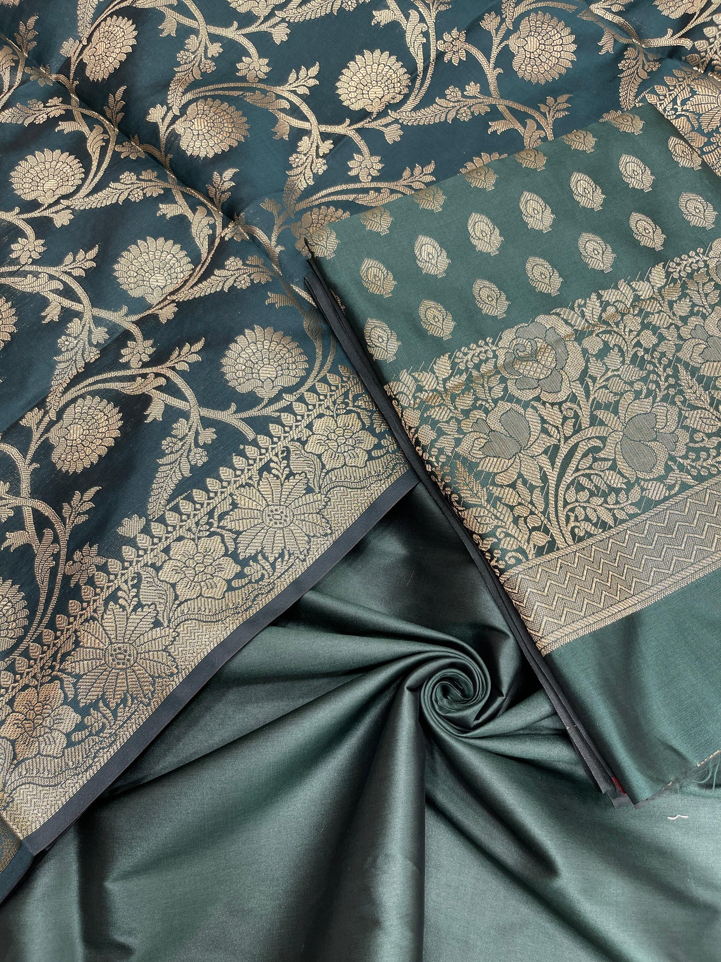 Dark green art silk suit set featuring floral zari bootis and matching dupatta. SHL_60