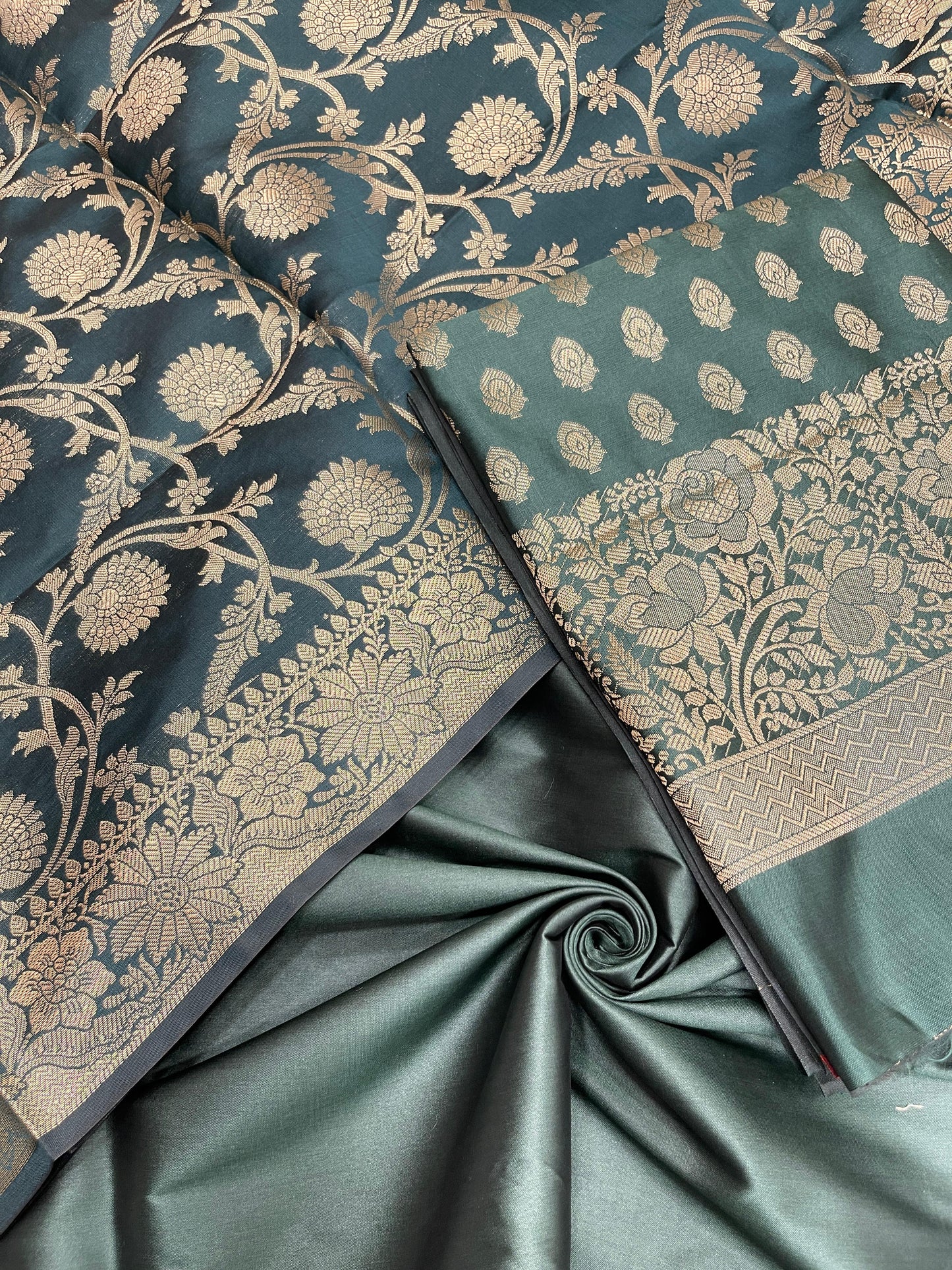 Dark green art silk suit set featuring floral zari bootis and matching dupatta. SHL_60