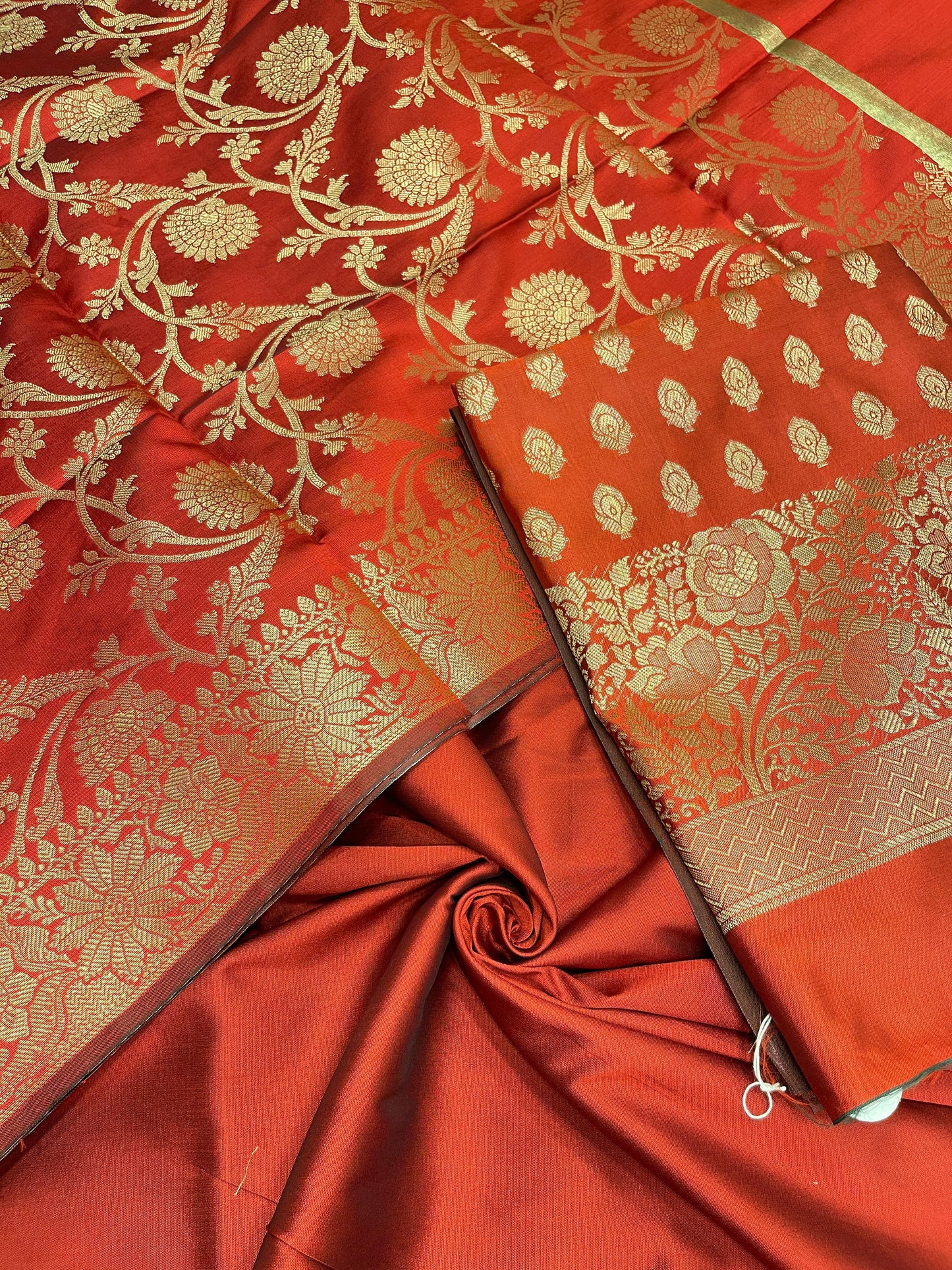 Red art silk suit set featuring floral zari bootis and matching dupatta. SHL_59