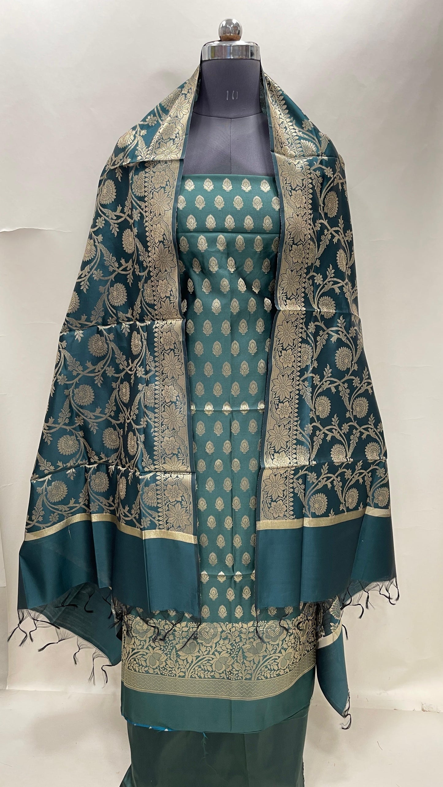 Dark green art silk suit set featuring floral zari bootis and matching dupatta. SHL_60