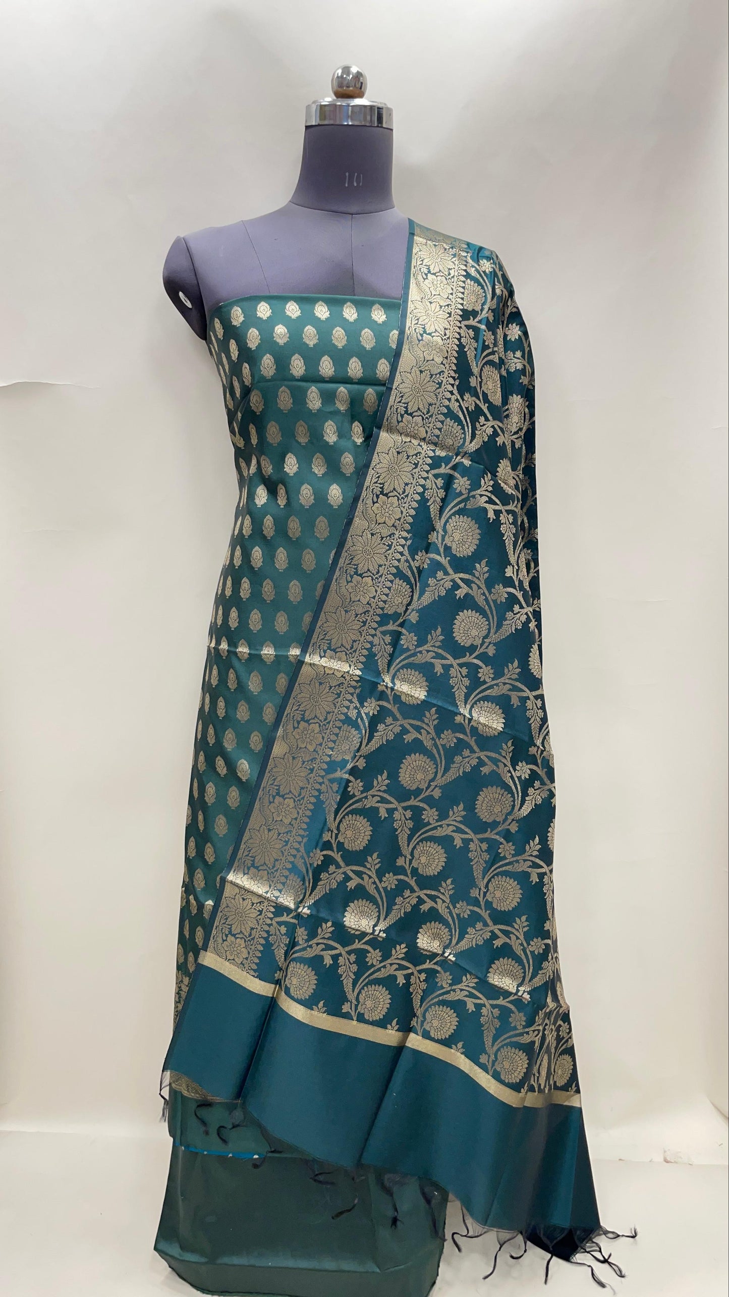 Dark green art silk suit set featuring floral zari bootis and matching dupatta. SHL_60