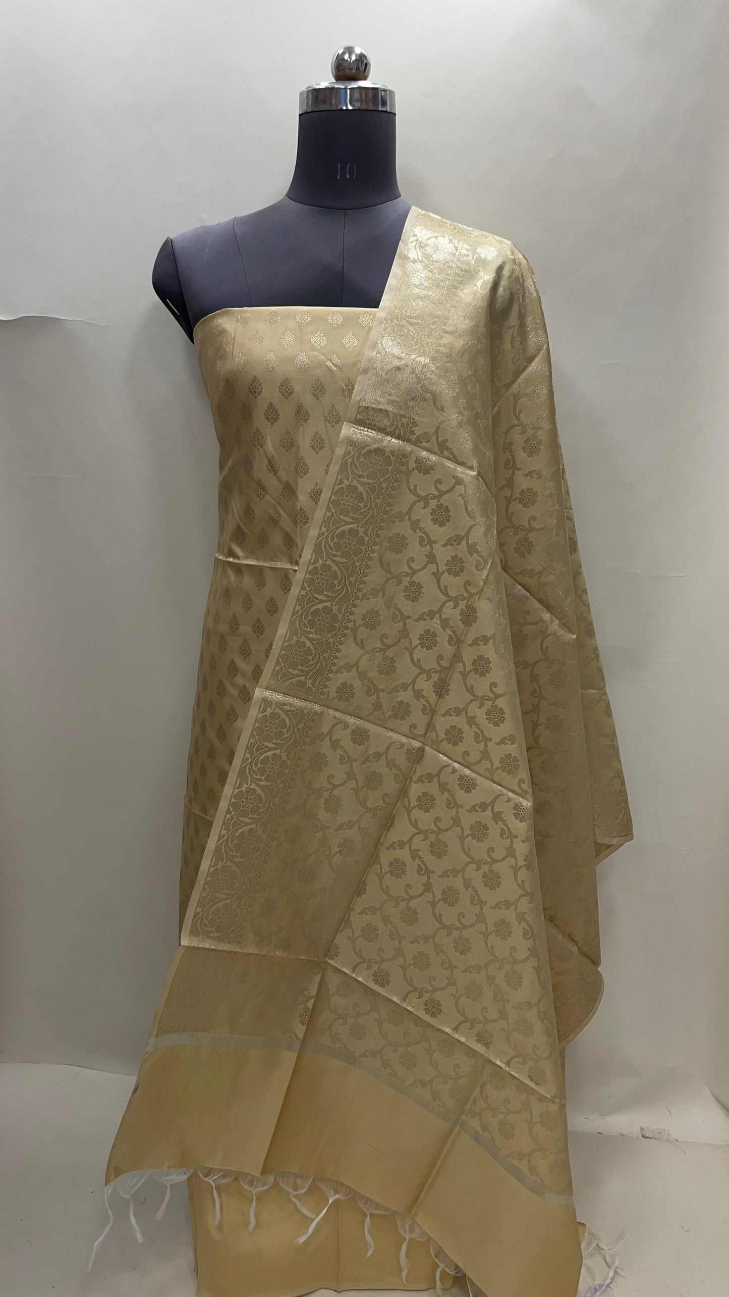 Cream art silk suit set featuring floral zari bootis and matching dupatta. SHL_62
