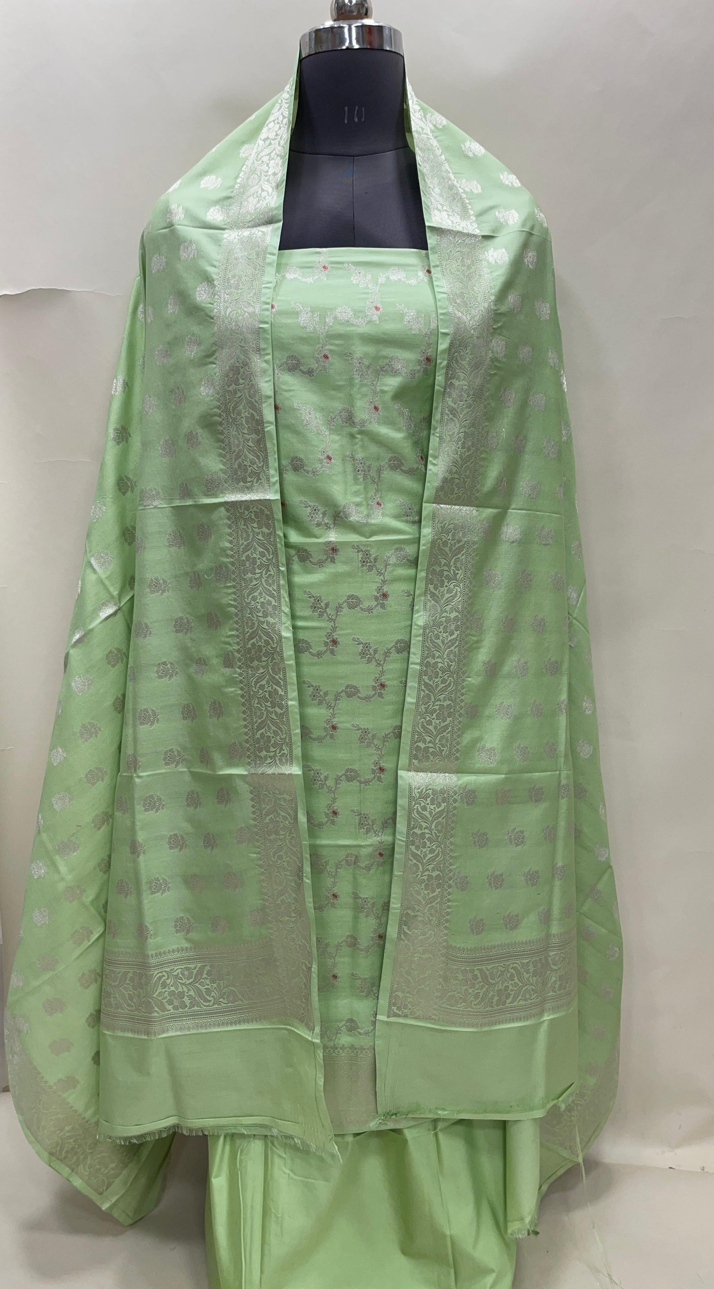 Light green katan chiniya silk suit set with floral silver zari mina jaal dupatta. SHL_50
