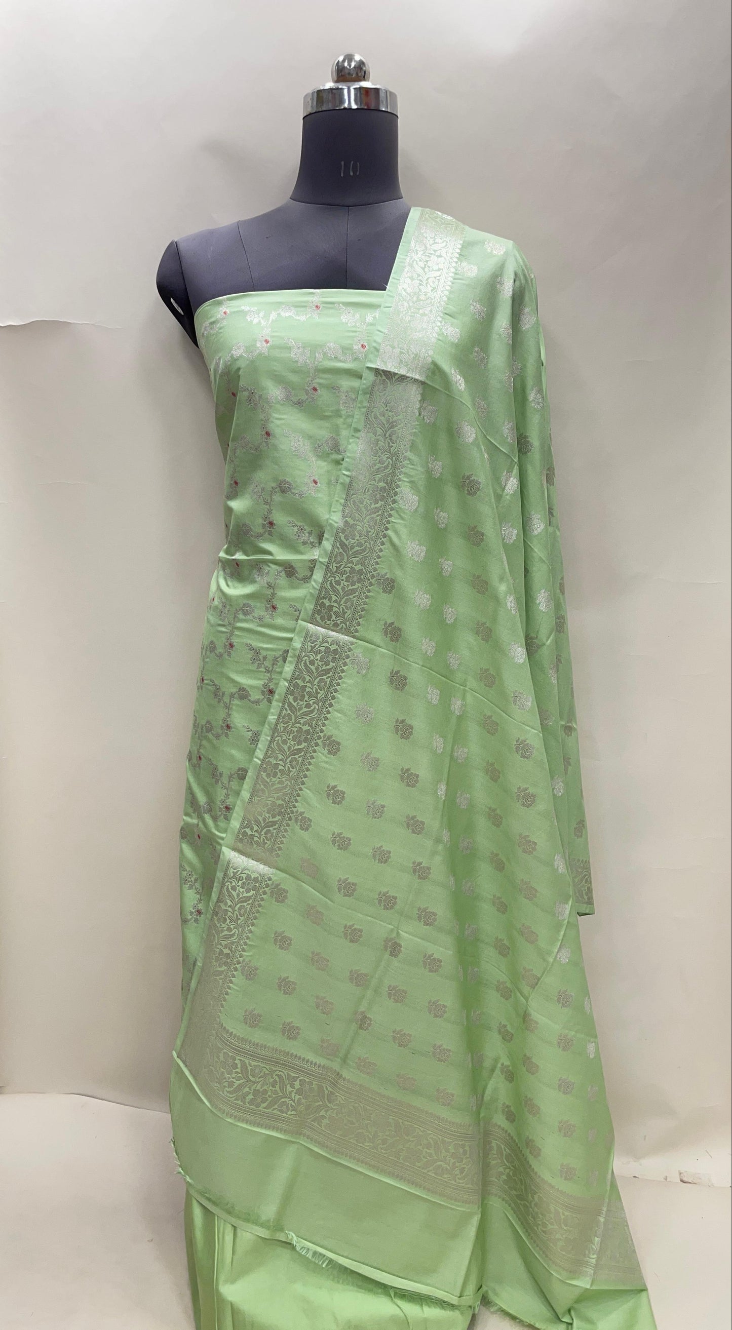 Light green katan chiniya silk suit set with floral silver zari mina jaal dupatta. SHL_50