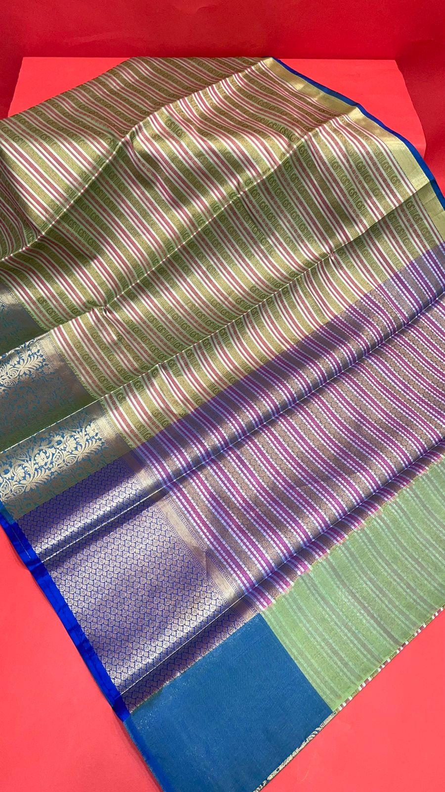 Faishana Presents Green Zari Strip Kanchi Silk Tanchoi Brocade Contrast Torqouise Blue Skirt Border Banarasi Saree