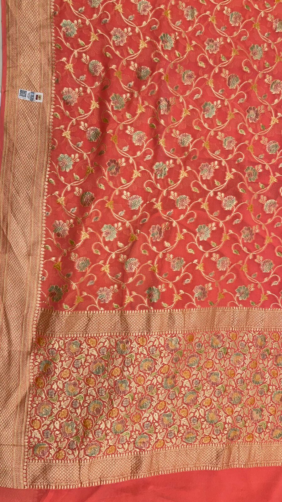 Radiant Threads: Faishana's Pure Silk Handloom Orange Khaddi Georgette Hand Brush Floral Zari Kadhwa Jaal with Banarasi Zari Border with an Orange Blouse