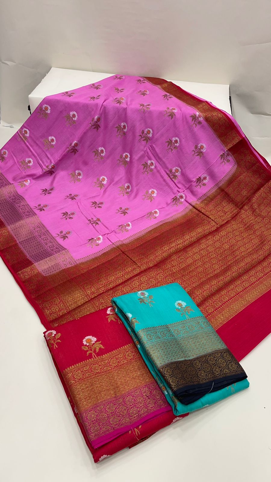 Radiant Elegance: Faishana Pure Silk Handloom Pink Muga Silk Saree with Zari Mina Floral Booti and Contrasting Red Anchal Copper Zari Border and Paired with a Red Blouse