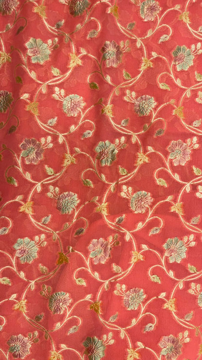 Radiant Threads: Faishana's Pure Silk Handloom Orange Khaddi Georgette Hand Brush Floral Zari Kadhwa Jaal with Banarasi Zari Border with an Orange Blouse