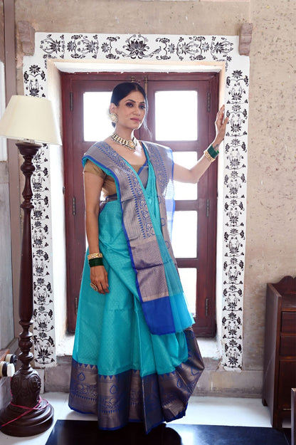 Faishana Presents Turquoise Blue Resham Brocade Contrast Blue Zari Pattu Border Banarasi Saree