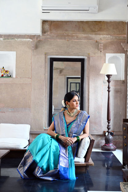 Faishana Presents Turquoise Blue Resham Brocade Contrast Blue Zari Pattu Border Banarasi Saree