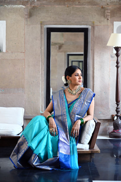 Faishana Presents Turquoise Blue Resham Brocade Contrast Blue Zari Pattu Border Banarasi Saree
