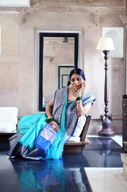 Faishana Presents Turquoise Blue Resham Brocade Contrast Blue Zari Pattu Border Banarasi Saree