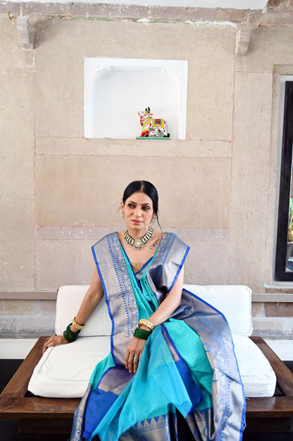 Faishana Presents Turquoise Blue Resham Brocade Contrast Blue Zari Pattu Border Banarasi Saree