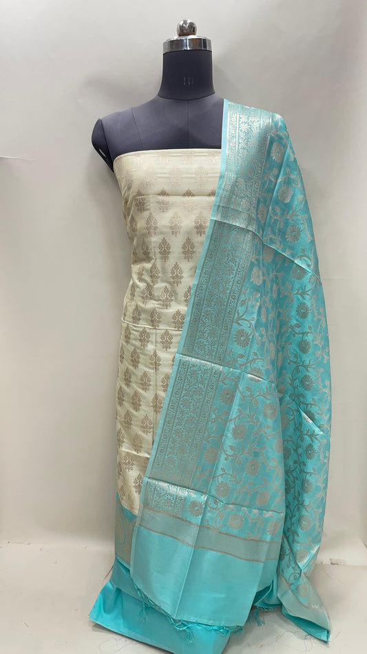 Faishana Presents Off white Semi Katan Silk Floral Zari Booti 3 pcs Suit Set with Contrast Blue Plain Bottom and Tilfi Jaal Blue Dupatta ASD_121