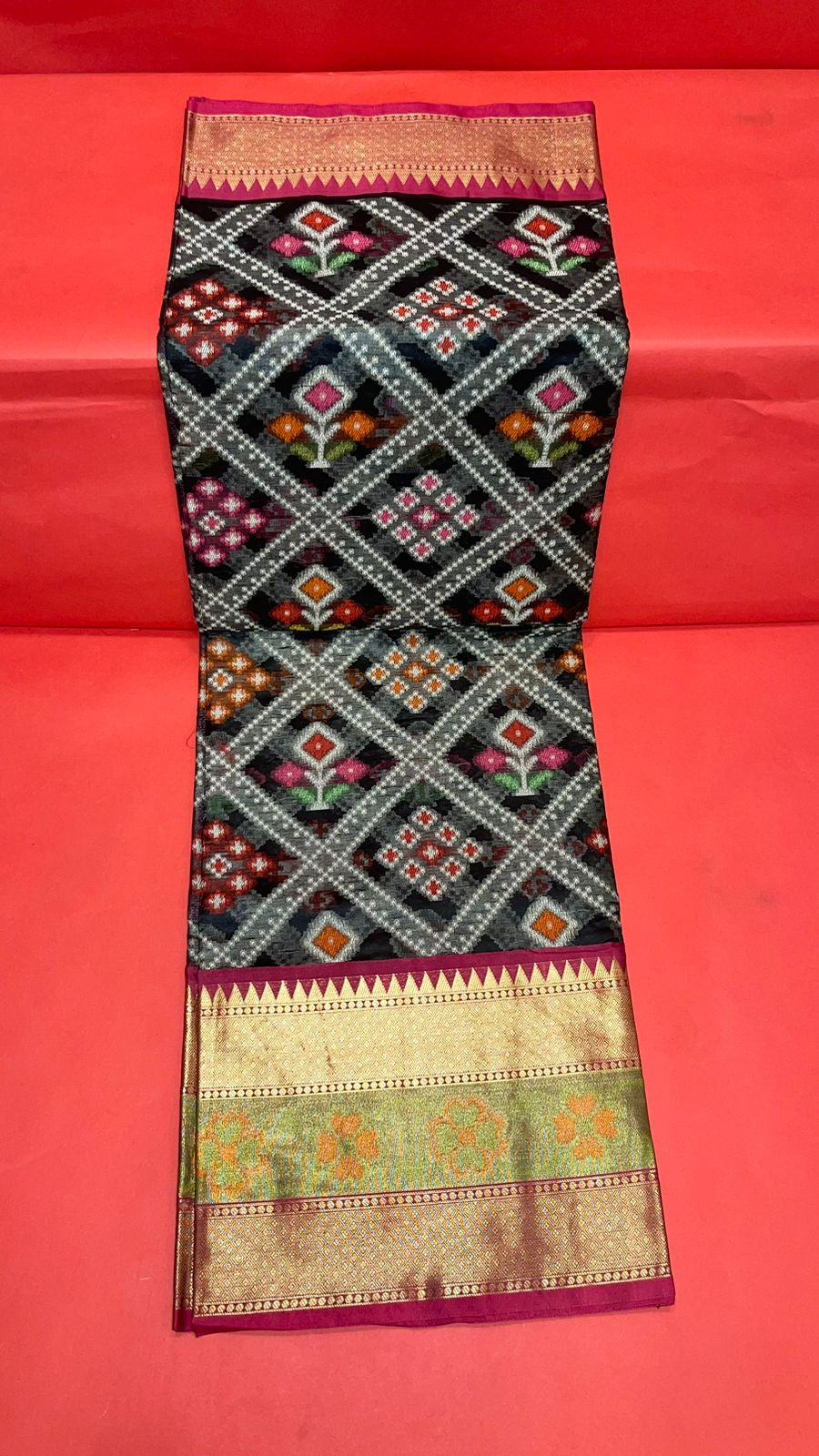 Faishana Presents Black & Magenta Ikkat Patola Art Silk Skirt Pattu Border With Magenta Blouse Banarasi Saree