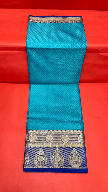Faishana Turquoise Blue Resham Brocade Saree With Contrast Blue Zari Pattu Border