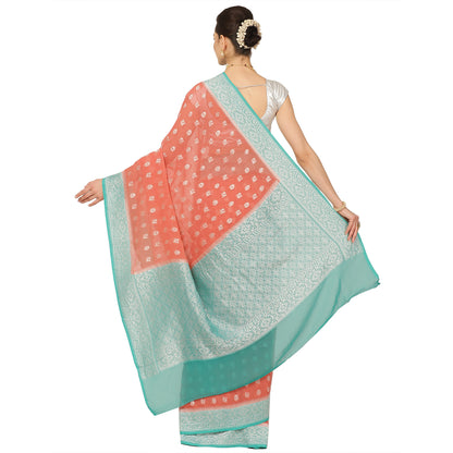 Faishana Presents Peach Pure Banarasi Khaddi Chiffon Georgette Silver Zari Booti Weaving Kadiyal Seagreen Border. with Seagreen Blousw.
