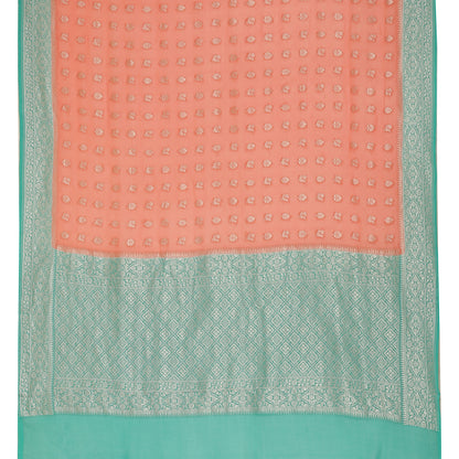 Faishana Presents Peach Pure Banarasi Khaddi Chiffon Georgette Silver Zari Booti Weaving Kadiyal Seagreen Border. with Seagreen Blousw.