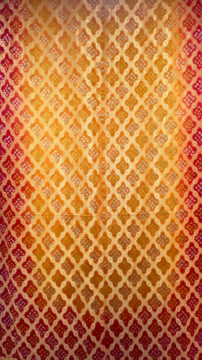 Sunset Splendor: Faishana's Vibrant 2D Yellow and Orange Katan Georgette Bandhej Zari Kadhwa Jaal Chunri Booti with Kadhwa Contrasting Red Pallu and Blouse Saree