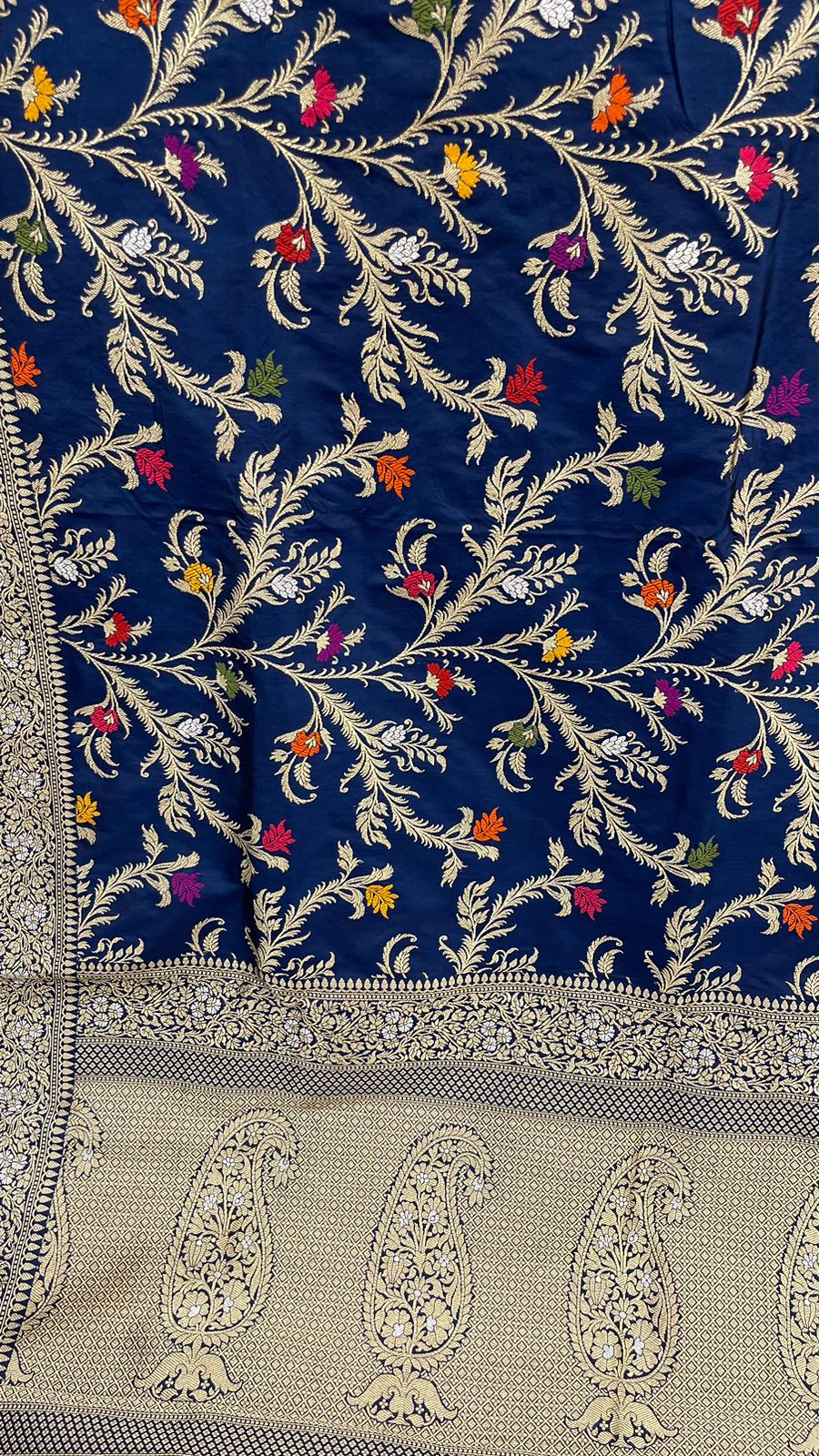 Symphony of Elegance and Tradition: Faishana Pure Handloom Navy Blue Katan Silk Multicolor Minakari Kadhwa Jaal and Zari Border with Navy Stripe Blouse