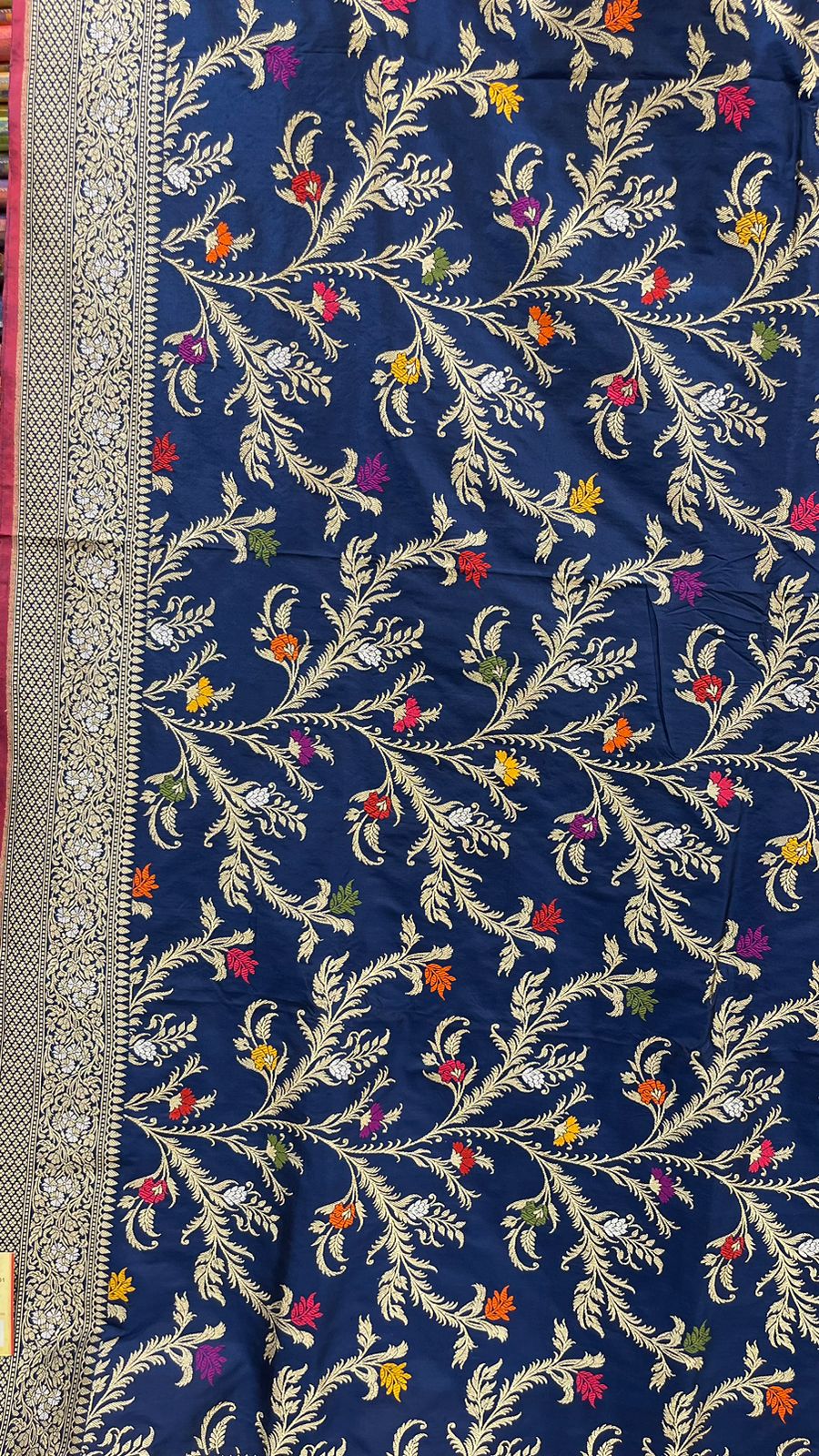 Symphony of Elegance and Tradition: Faishana Pure Handloom Navy Blue Katan Silk Multicolor Minakari Kadhwa Jaal and Zari Border with Navy Stripe Blouse