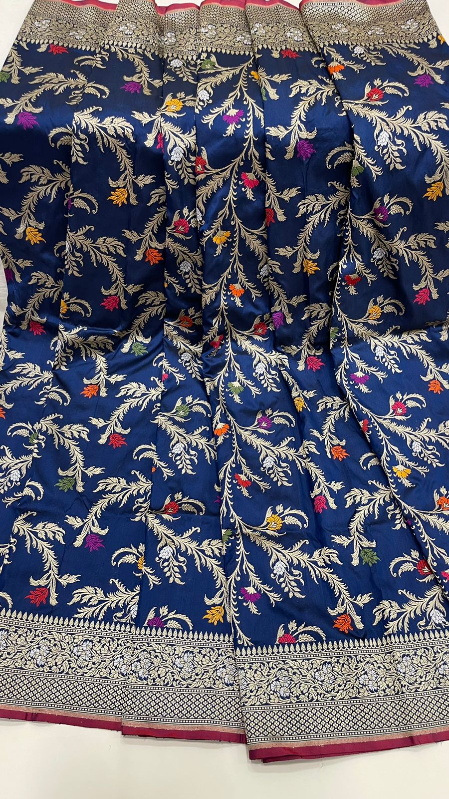 Symphony of Elegance and Tradition: Faishana Pure Handloom Navy Blue Katan Silk Multicolor Minakari Kadhwa Jaal and Zari Border with Navy Stripe Blouse