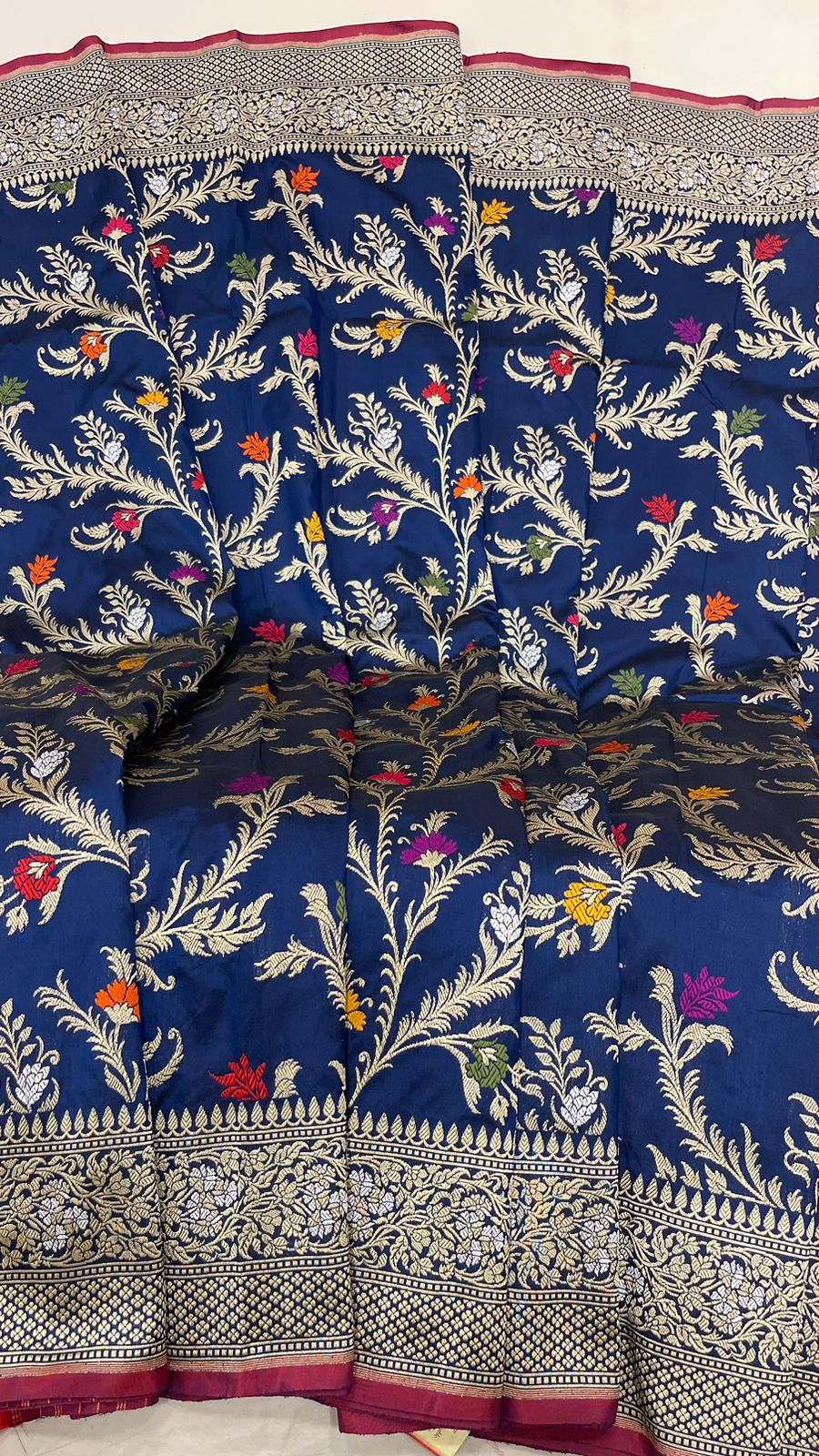Symphony of Elegance and Tradition: Faishana Pure Handloom Navy Blue Katan Silk Multicolor Minakari Kadhwa Jaal and Zari Border with Navy Stripe Blouse